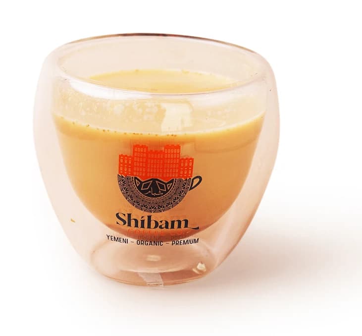Shibam Coffee in a branded glass